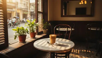 AI: A cozy Vietnamese coffee shop at 6am,
warm golden light streaming through woode...